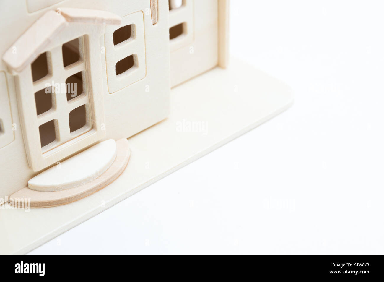 Miniature wooden toy house isolated on white background Stock Photo - Alamy