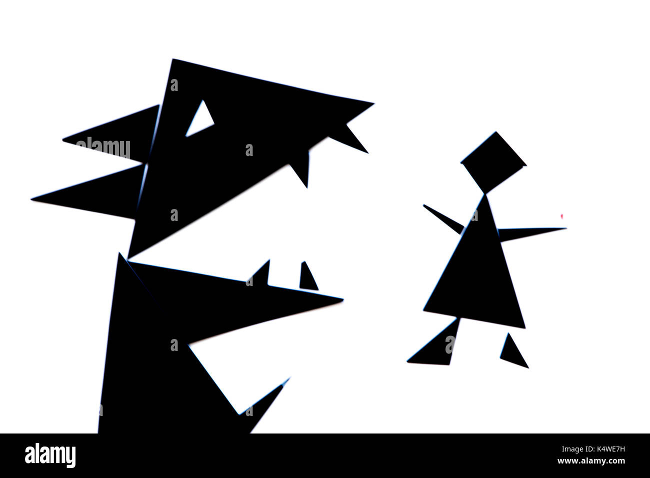 An abstract illustration of the red riding hood story with black and red triangles on a white background Stock Photo