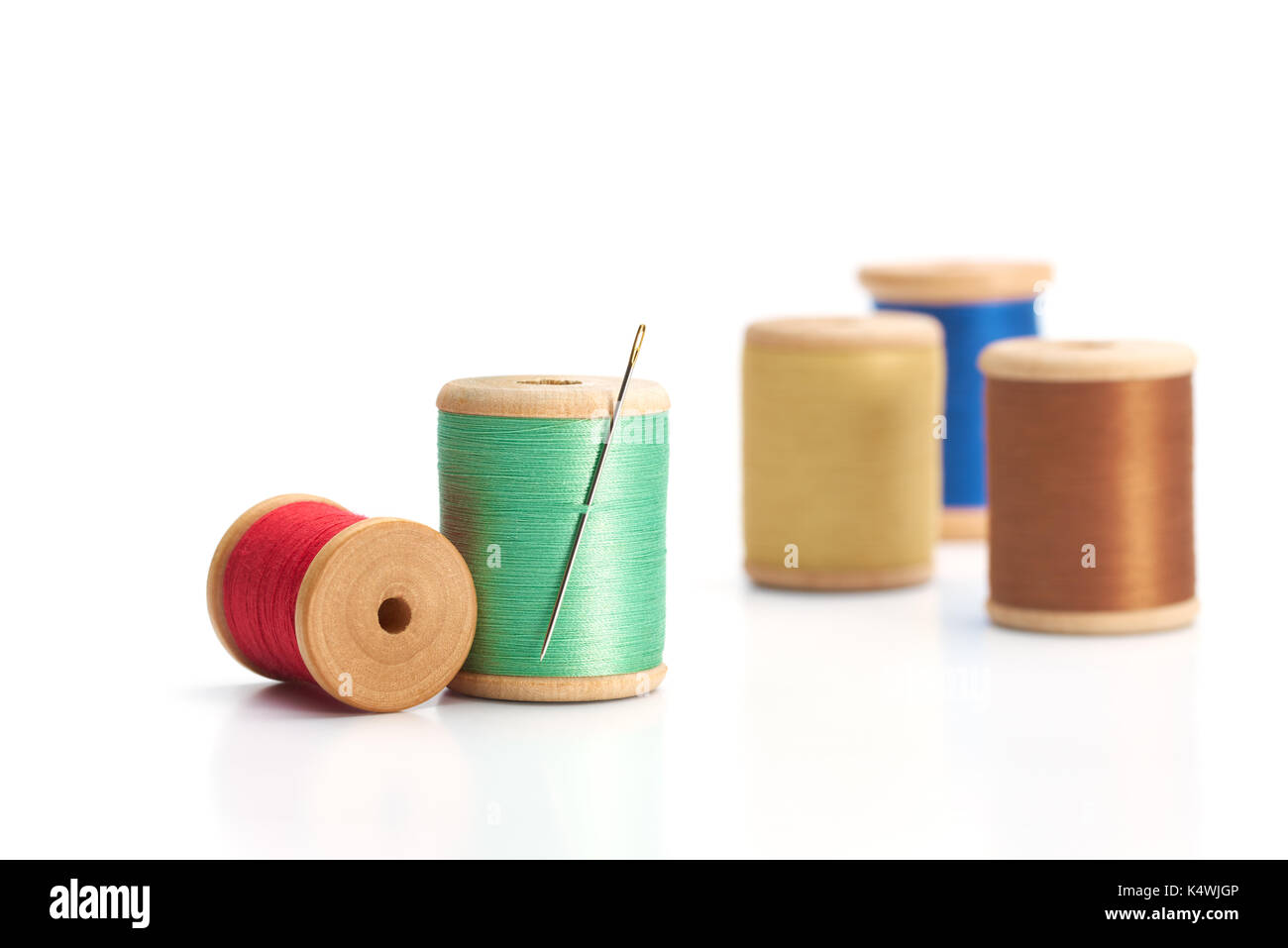 Spool of thread with needle isolated on white background Stock Photo