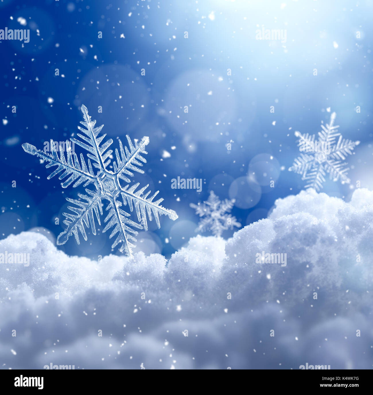 Snowflake on snow with bokeh background Stock Photo