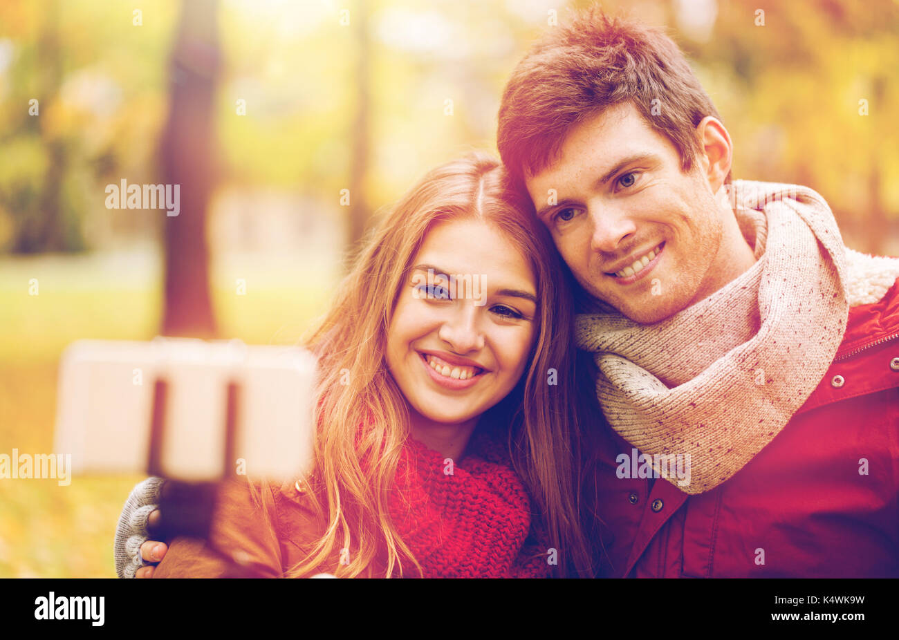 couple taking selfie by smartphone in autumn park Stock Photo - Alamy