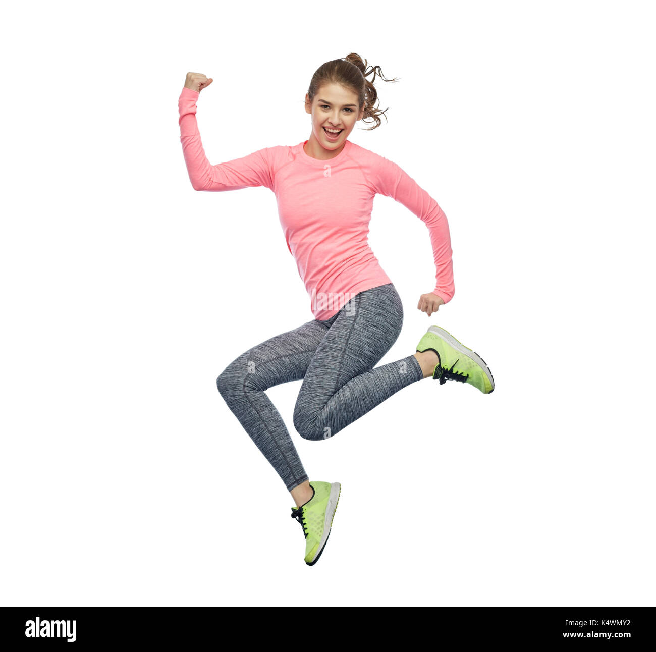 happy smiling sporty young woman jumping in air Stock Photo - Alamy