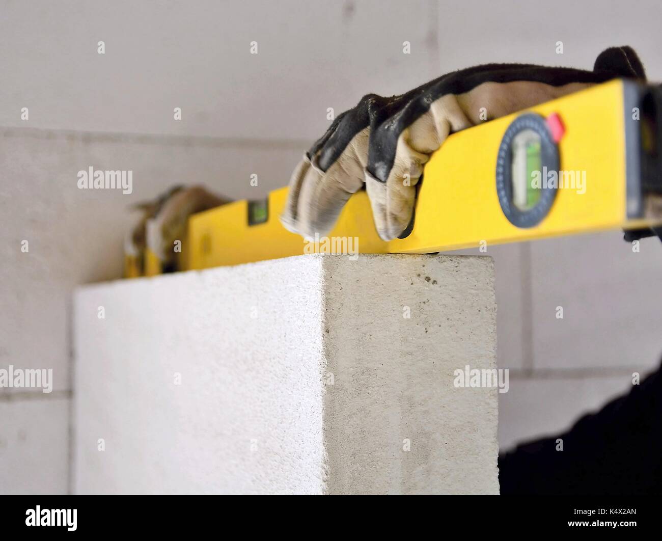 Building Worker Measuring The Wall With A Water Level At Construction Stock Photo Alamy Building Worker Measuring The Wall With A Water Level At Construction Stock Photo Alamy