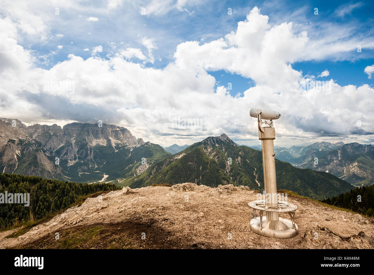 Binoculars on the background of the beautiful Mountain view. Italian Alps Stock Photo