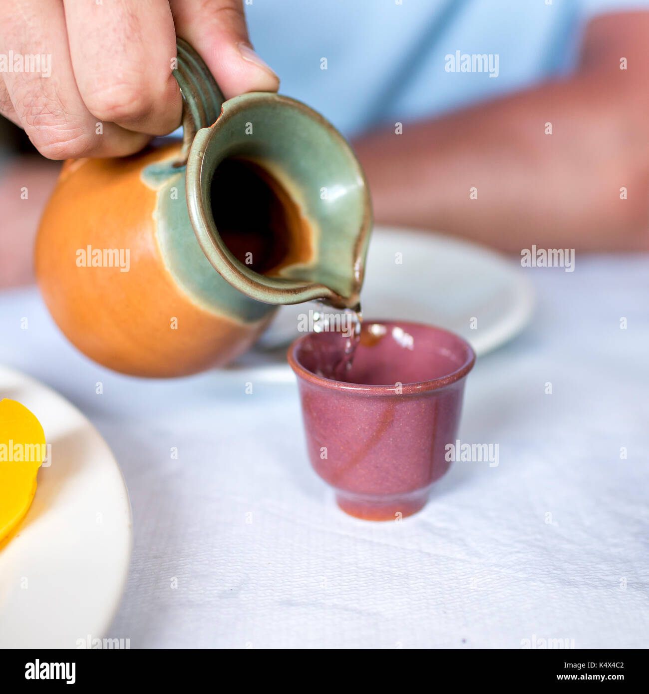 Pouring greek raki Stock Photo