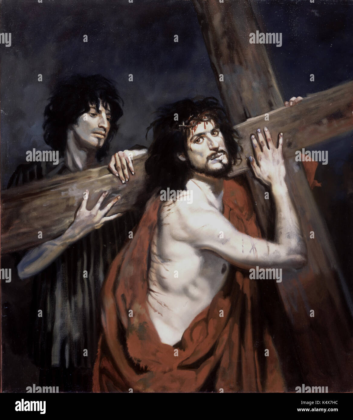 Christ and Simon of Cyrene at Auschwitz-Jesus caries His cross helped by Simon of Cyrene, in a striped uniform (now known as striped pyjamas). Stock Photo