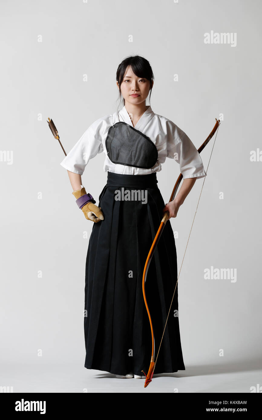 Japanese traditional archery athlete against white background Stock