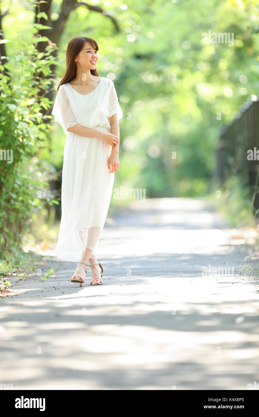 Beauty young woman walking road hi-res stock photography and images - Alamy