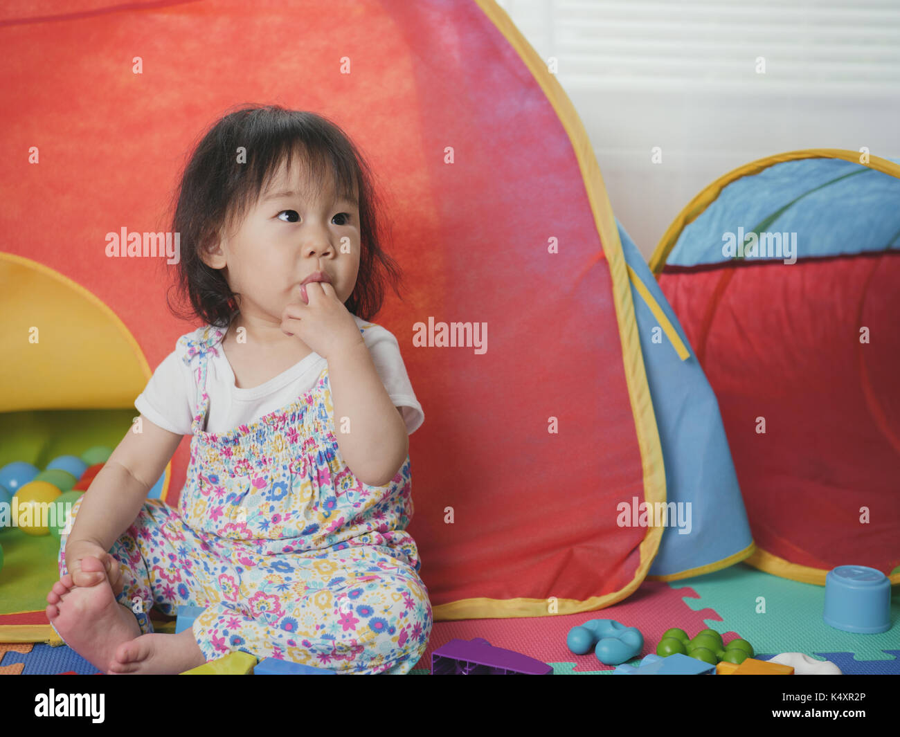 baby girl playing toy at home Stock Photo - Alamy