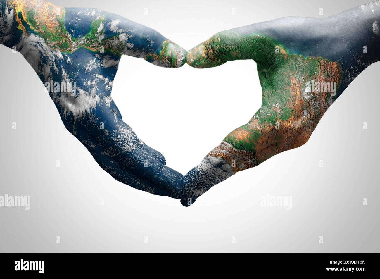 The hands of a young woman forming a heart patterned with a world map (furnished by NASA) Stock Photo