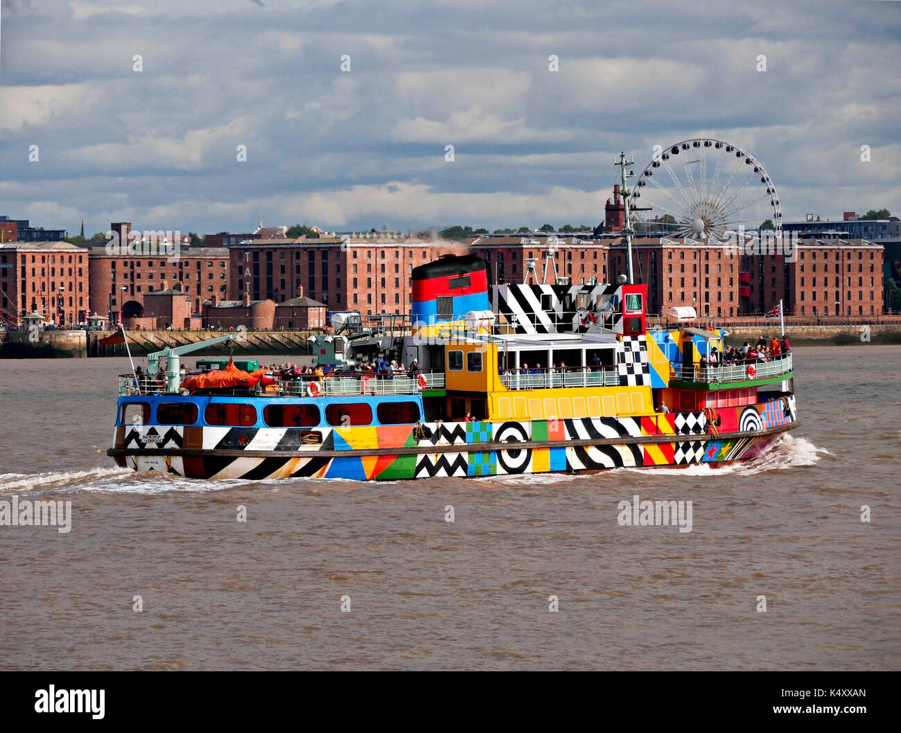 Mersey Ferry in dazzle livery against the backdrop of the Albert Dock, Liverpool. Stock Photo