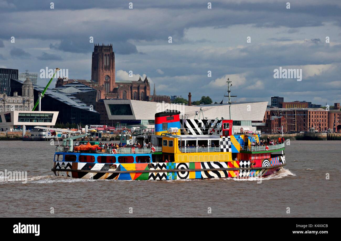 Mersey Ferry in dazzle livery against the backdrop of the Pier Head, Museum of Liverpool, Liverpool Cathedral and Albert Dock Stock Photo