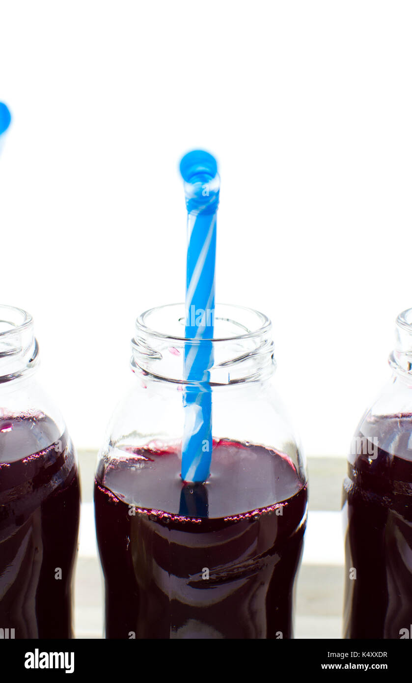 Download Blueberry Juice In Glass Bottles Isolated On White Background Stock Photo 157943459 Alamy PSD Mockup Templates