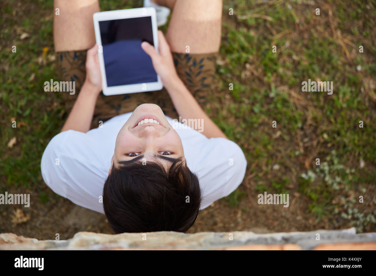 Aerial young man sitting on hi-res stock photography and images - Alamy