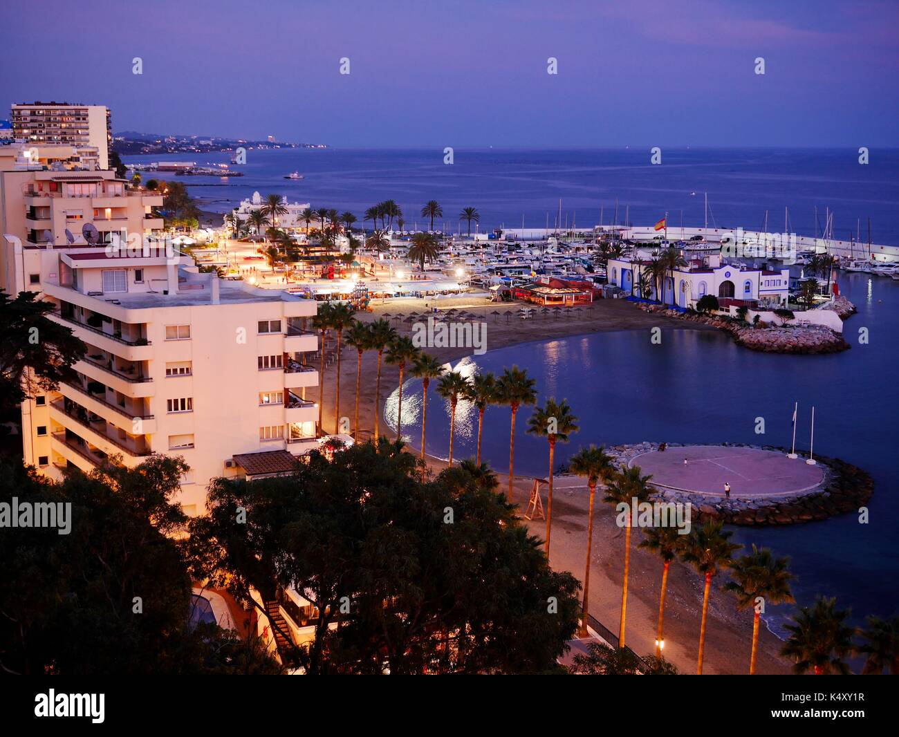 Night time view of the marina at Marbella, Costa del Sol, Spain Stock Photo