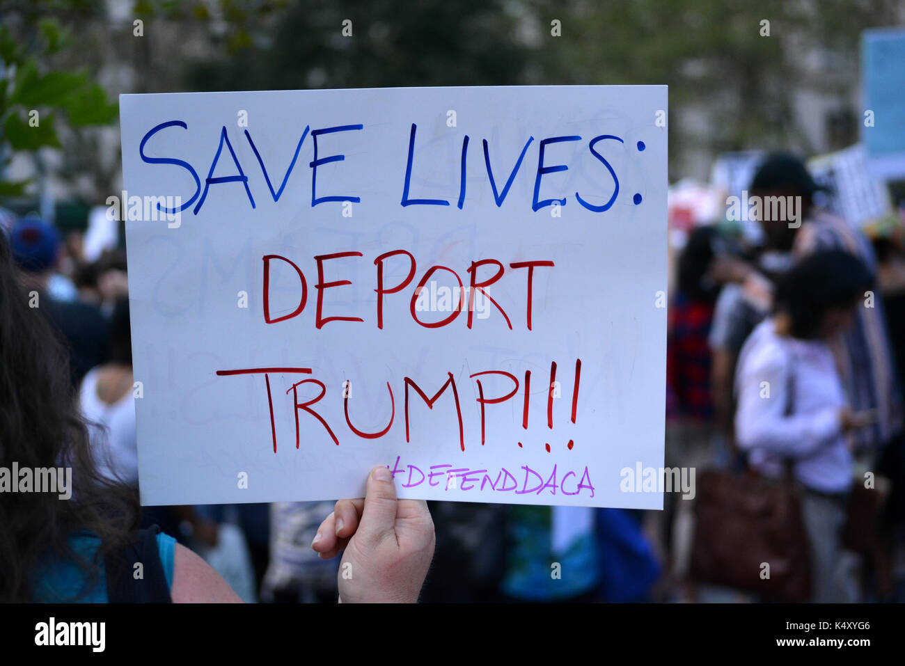 Sign protesting President Trump's decision to repeal the Deferred Action for Childhood Arrivals (DACA) policy in Lower Manhattan. Stock Photo