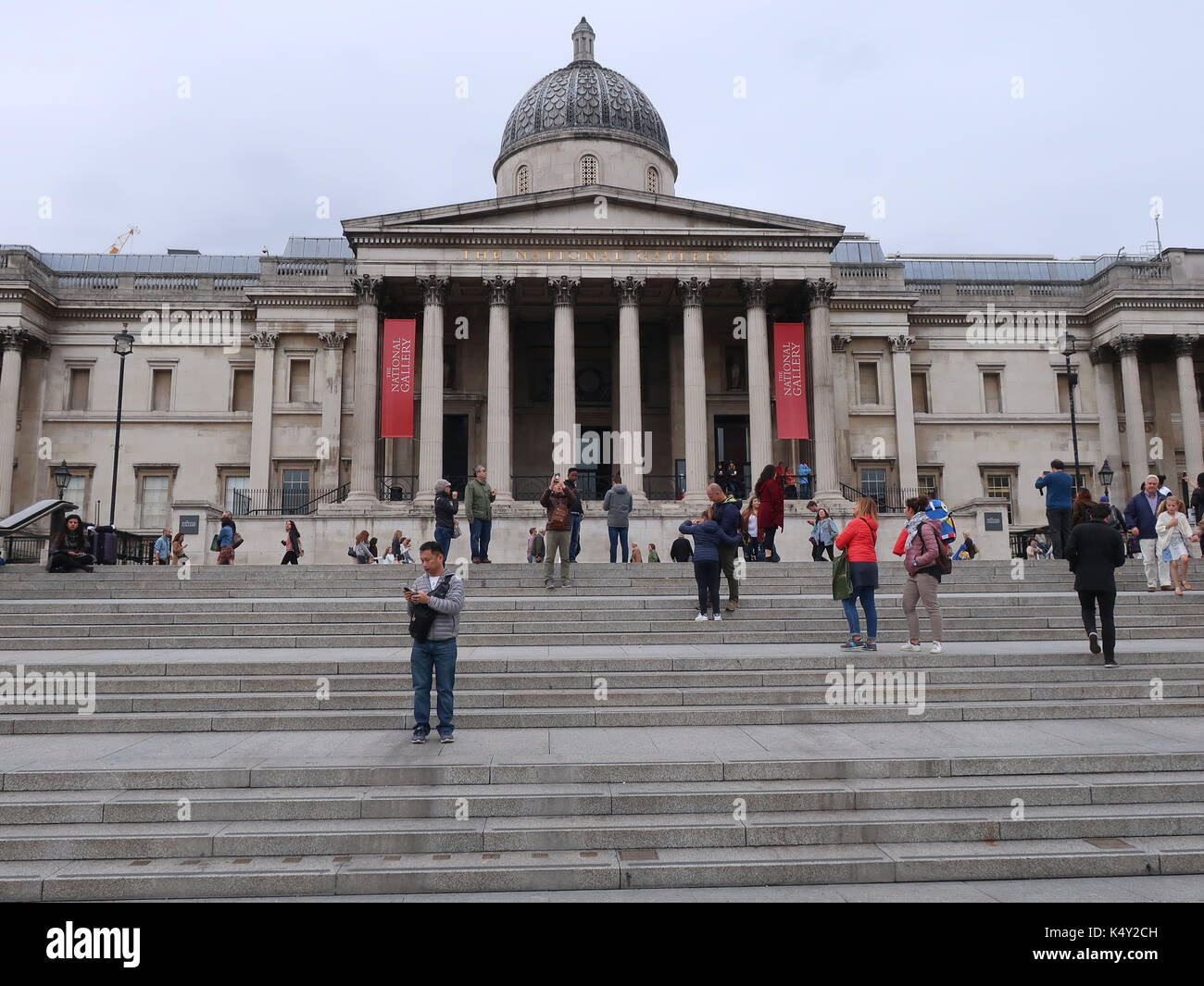 Visitors on the steps outside the National Gallery, Trafalgar Square
