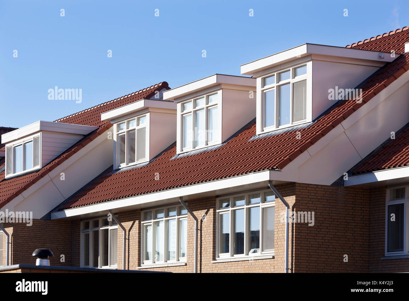 Red tiled roof with dormers in the Netherlands Stock Photo