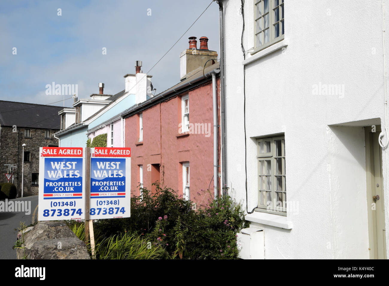 Sale Agreed estate agent sign outside cottage property in St Davids