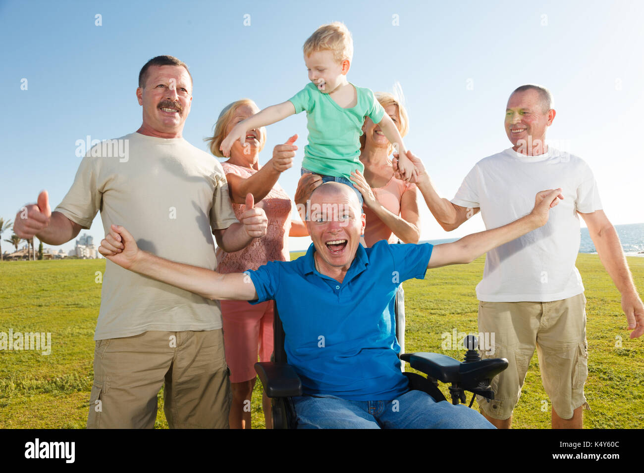 Group of happy people smiling with thumbs up. Stock Photo