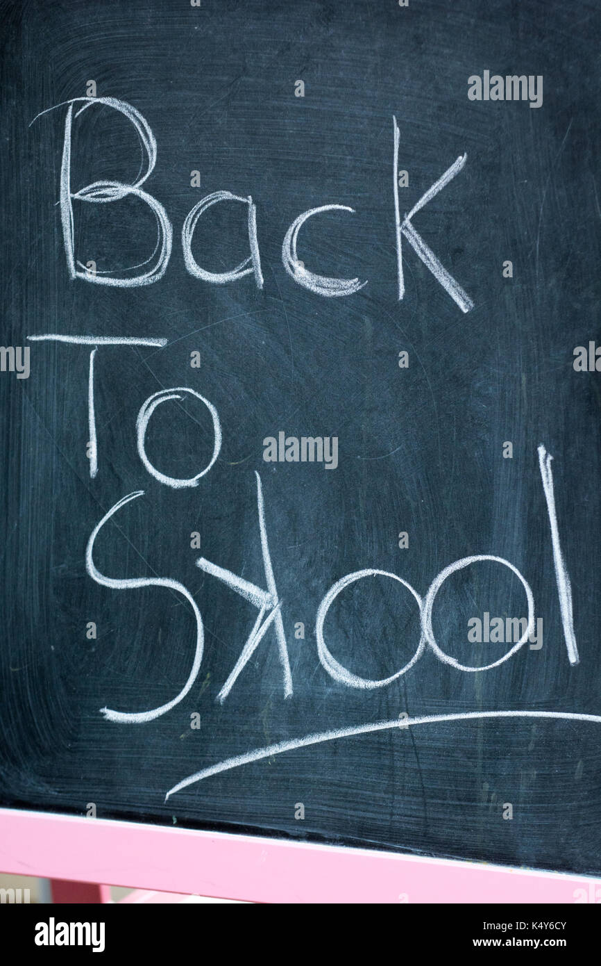Back to school text hand written on a chalk board Stock Photo - Alamy