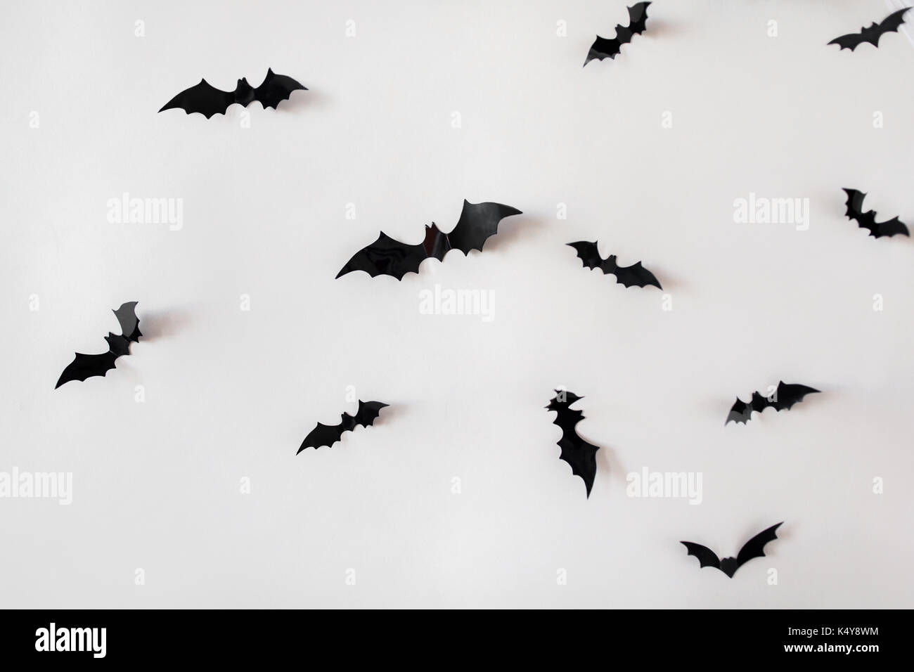 black paper bats over white background Stock Photo - Alamy