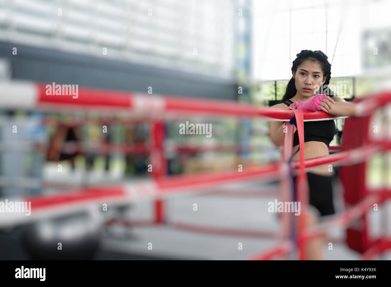 young woman prepare for exercise in fitness center. female boxer posing in  boxing ring in gym. sporty asian girl resting after working out in health c  Stock Photo - Alamy