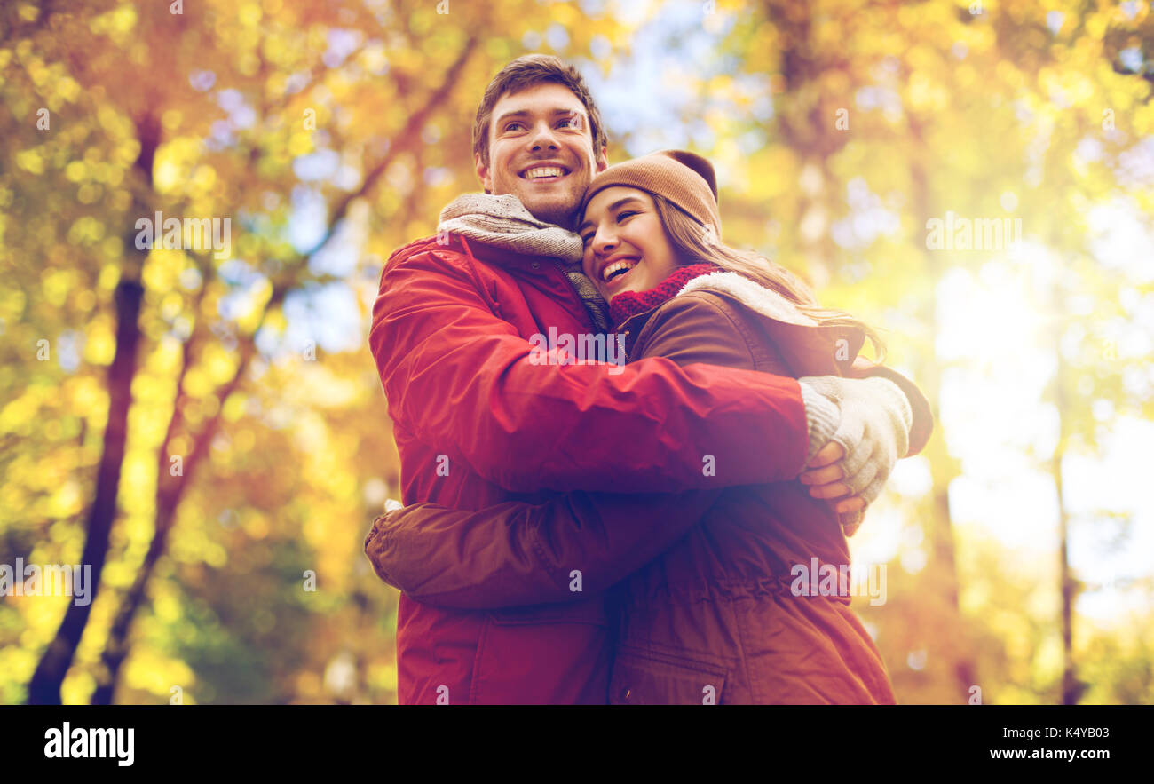 happy young couple hugging in autumn park Stock Photo - Alamy