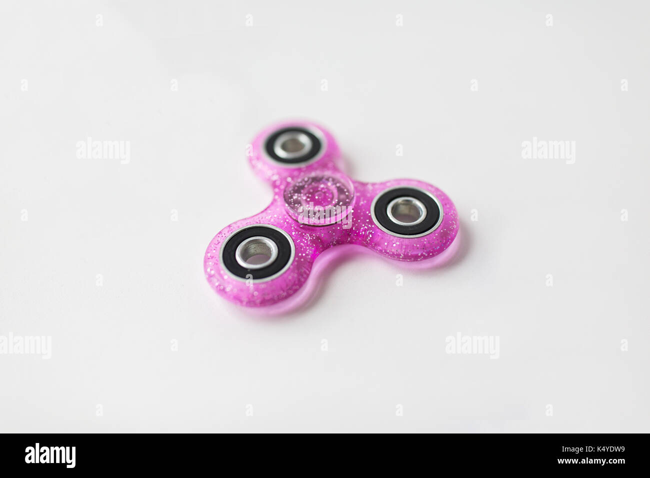 pink glittered fidget spinner Stock Photo