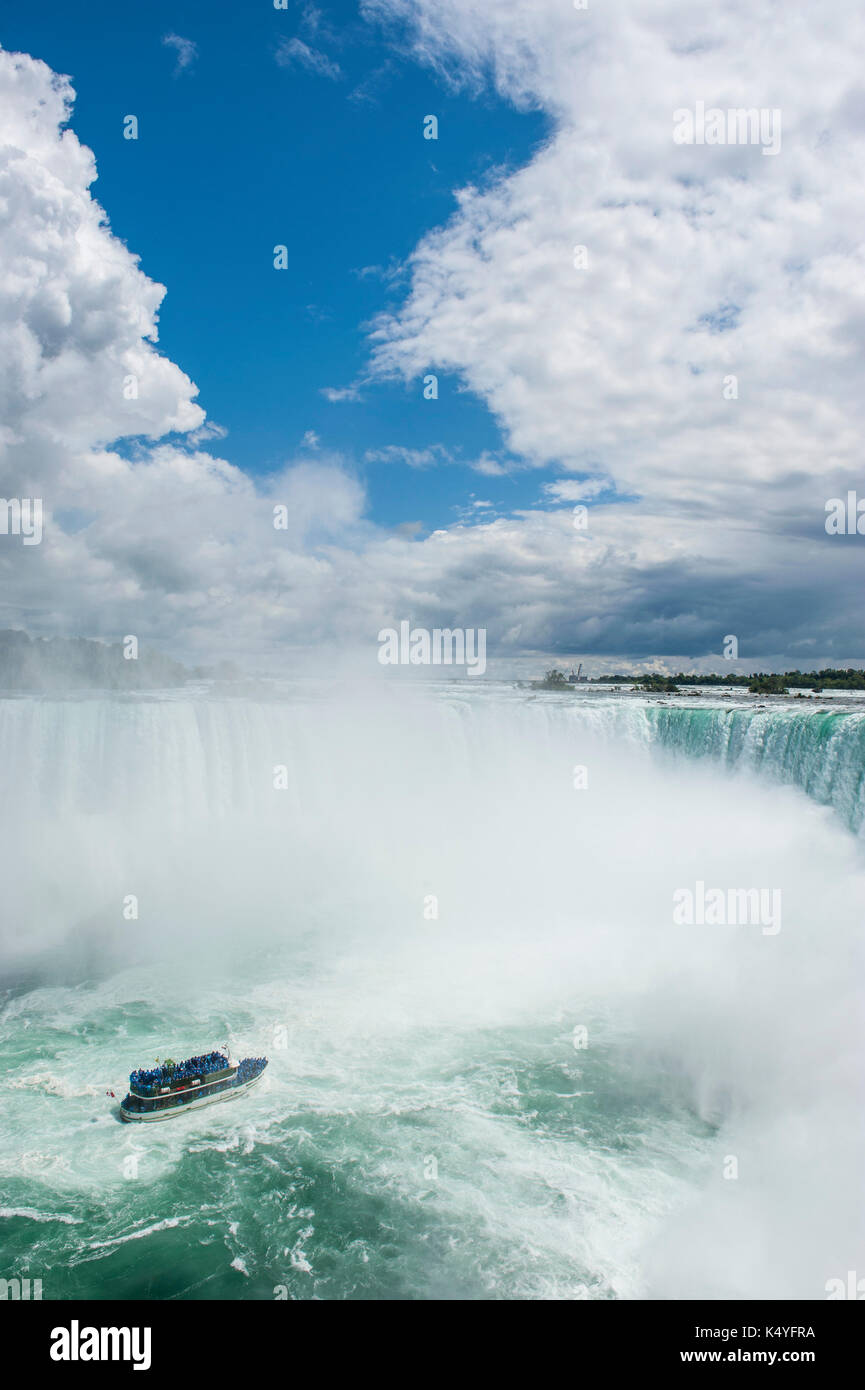 Tourist boat in the mist of the Horseshoe Falls, Canadian Falls, Niagara Falls, Ontario, Canada Stock Photo
