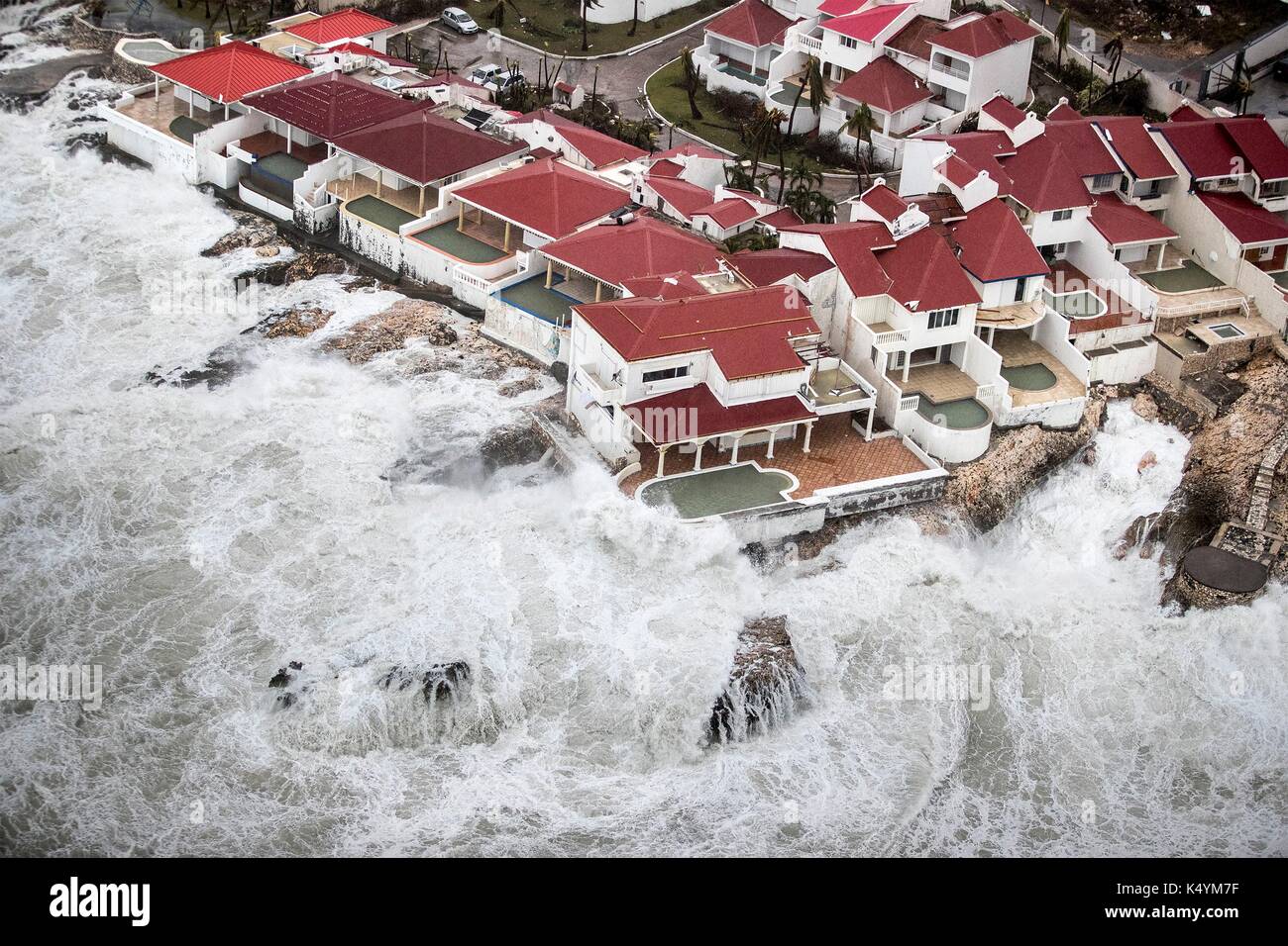 Philipsburg, St Maarten. 06th Sep, 2017. Storm serge and waves lash a resort on the Dutch Island of St. Maarten following a direct hit by Hurricane Irma, a Category 5 storm lashing the Caribbean September 6, 2017 in Philipsburg, St. Maarten. Imra is packing winds of 185-mph making it the strongest hurricane ever recorded in the Atlantic Ocean. (Gerben Van Es/Netherlands Defence Ministry via Planetpix) Stock Photo