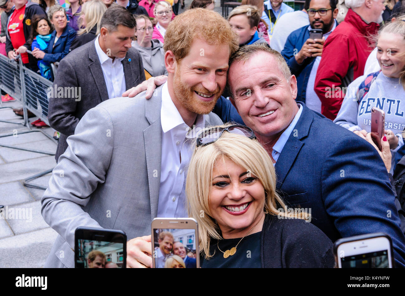 Belfast, Northern Ireland. 07/09/2017 -  People have their photos taken with Prince Harry as he meets the public during walkabout in Belfast on his first Northern Ireland visit. Stock Photo