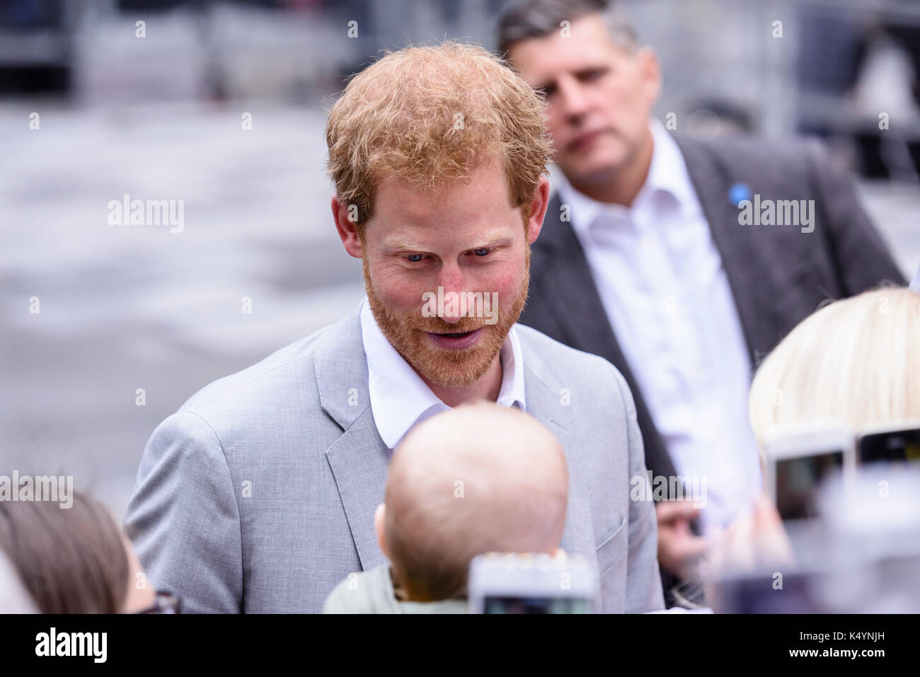 Belfast, Northern Ireland. 07/09/2017 -  Prince Harry stops to admire a baby during a walkabout in Belfast on his first Northern Ireland visit. Stock Photo