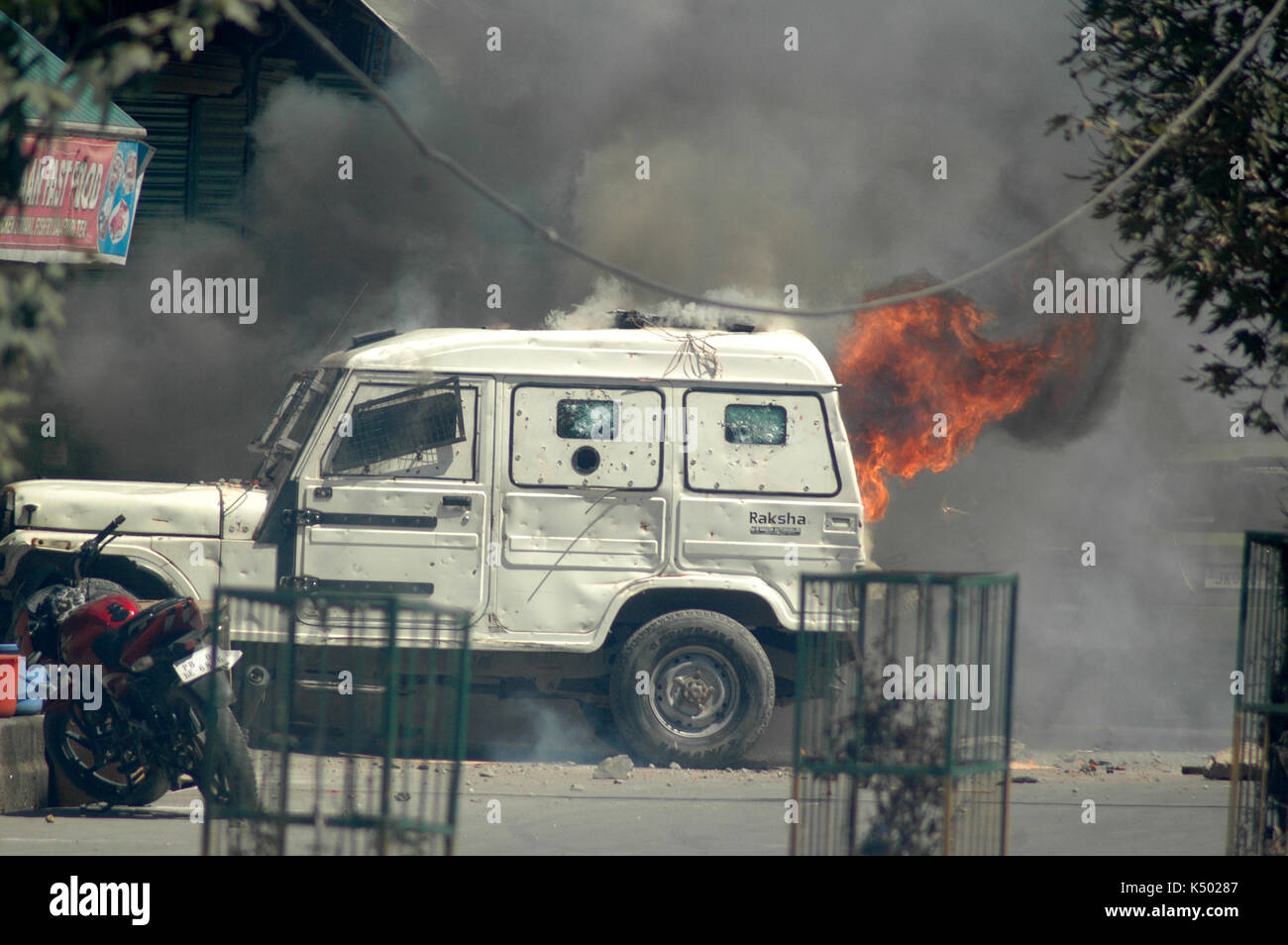 Pro-Rohingya protests held across Jammu and Kashmir, world silence condemned. In Kashmir, protests were held in Srinagar, Sopore, Tral, Pampore and Anantnag areas in which world silence over the Rohingya issue was condemened and slogans raised against the Myanmar government for the “genocide” of Muslims in the Rakhine state.  After culmination of Friday prayers, scores of people staged demonstrations at lal chowk  Anantnag which was later turned into clashes. Angry protesters also torched a police vehicle while six policemen sustained injuries during the clashes in Lal Chowk area of Anantnag Stock Photo