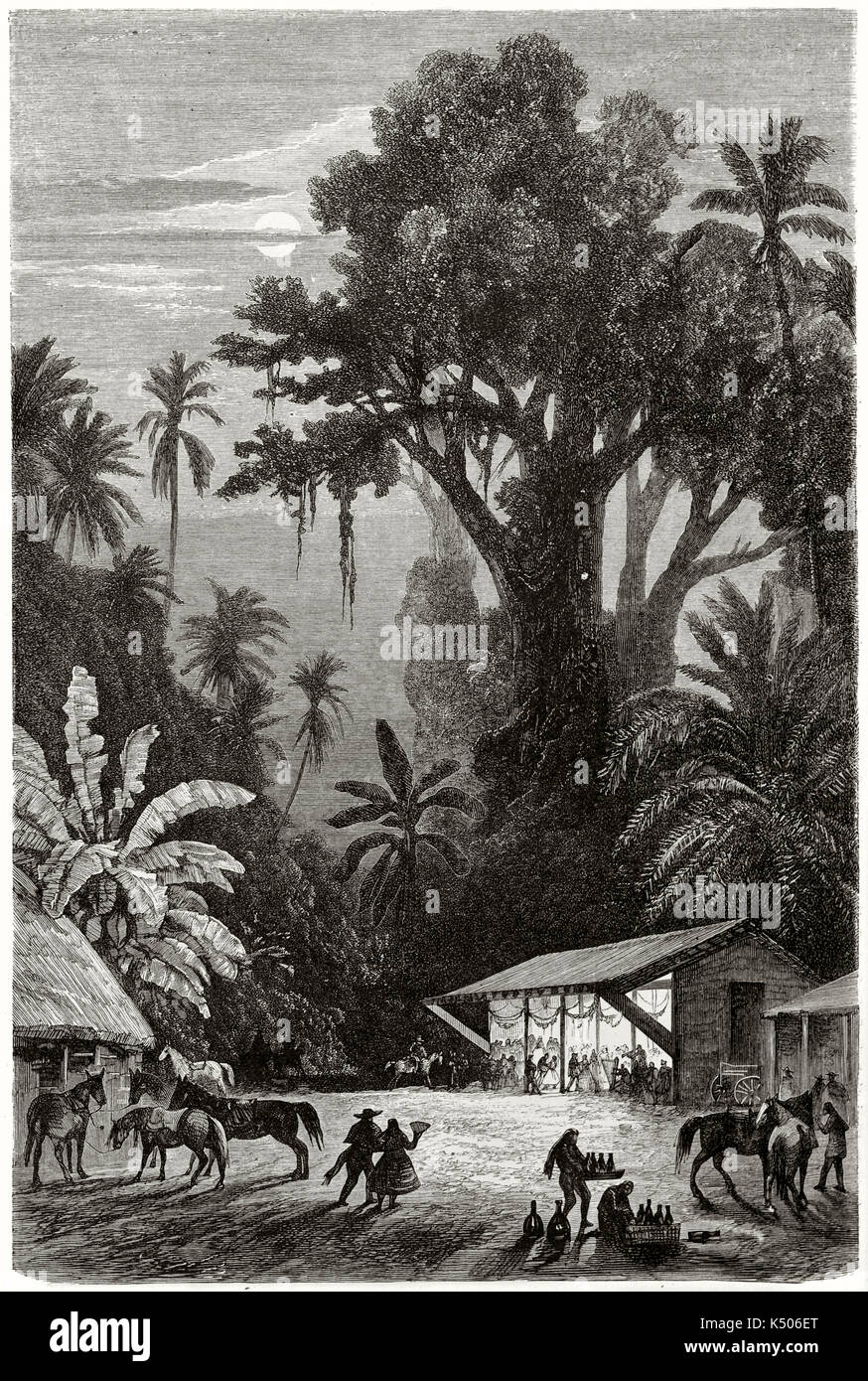 Old vertical illustration of nocturnal feast in Tierra Caliente (Hot Land) Mexico. Traditional huts and big jungle palms and trees. Moon high behind clouds. By De Berard on Le Tour du Monde Paris 1862 Stock Photo