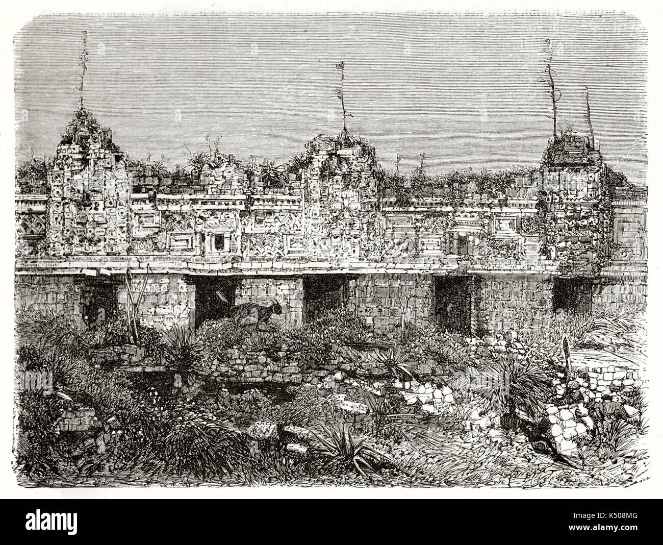 Ancient Maya stone monument full of decoration and bas-relief ruined and invaded by fauna and vegetation. Nunnery Quadrangle in Uxmal ancient Maya city Mexico. By Guaiaud on Le Tour du Monde 1862 Stock Photo