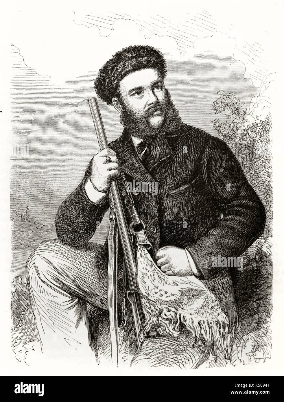 Ancient bearded man posing seated with his shotgun and wearing a fur cap.  Theodore von Heuglin (1824 - 1876) German explorer and ornithologist. By Handamard and Hildebrand on Le Tour du Monde 1862 Stock Photo
