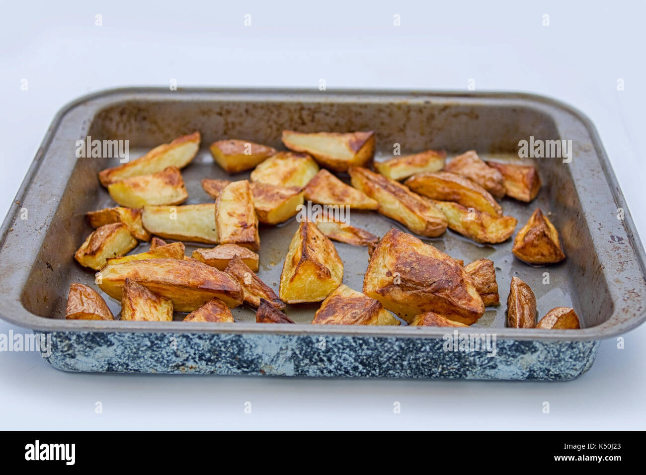 Roasted potatoes in oven casserole Stock Photo Alamy
