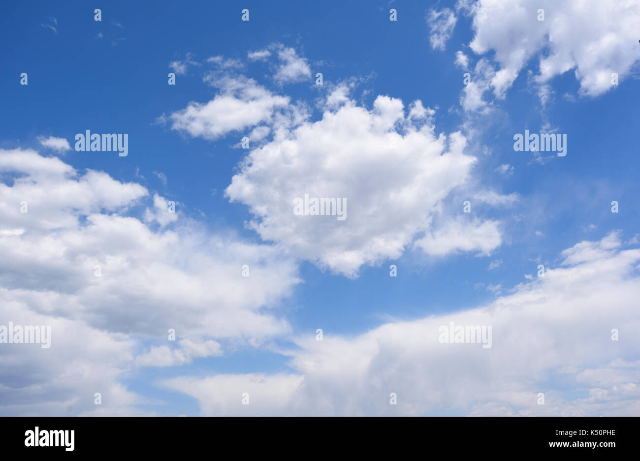 White clouds against blue sky background Stock Photo - Alamy