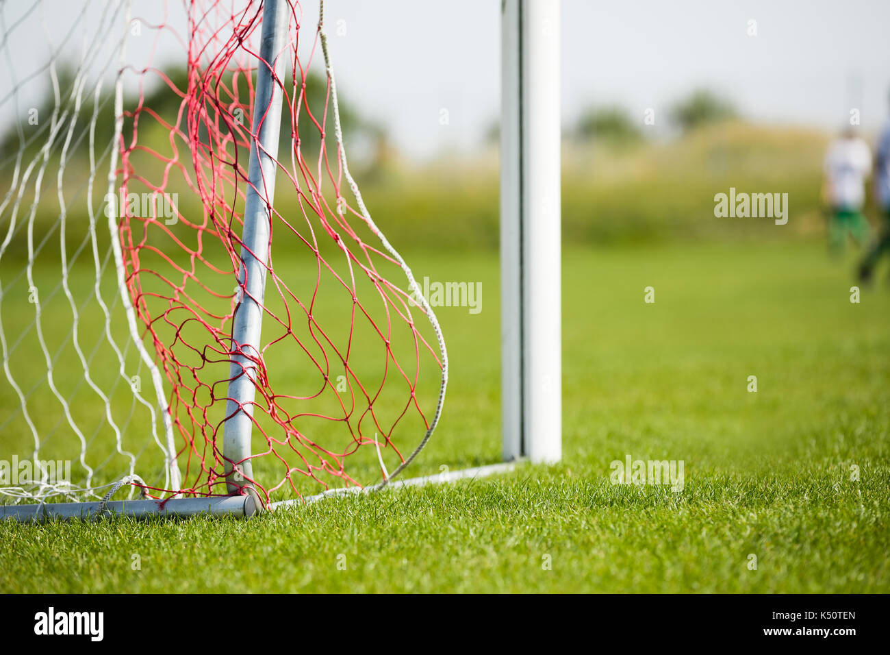 Football Goal Detail With A Soccer Players In The Background Stock Photo Alamy