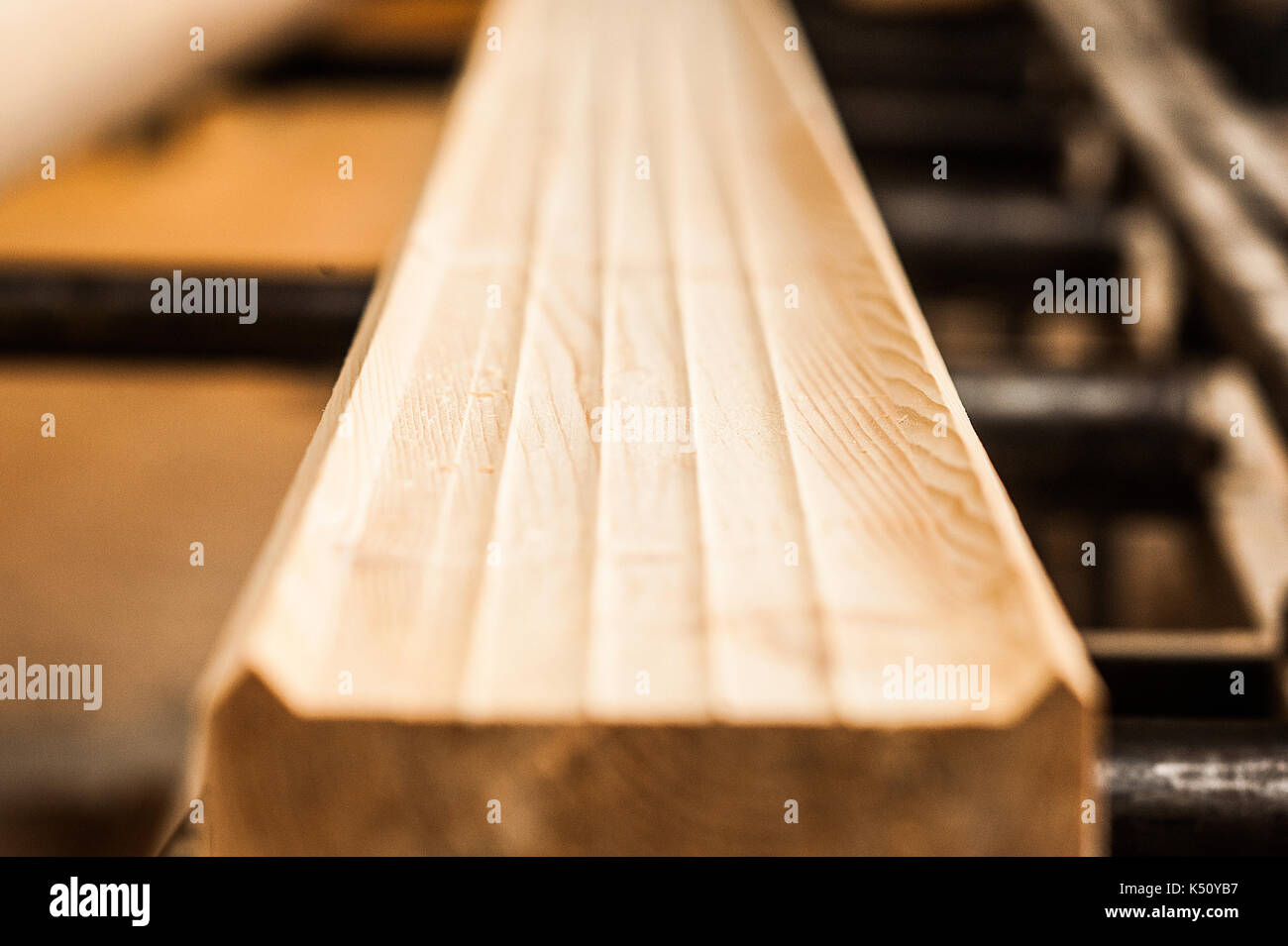 Fresh wooden beam, stacked at construction site. The surface of the processed wooden beam Stock Photo