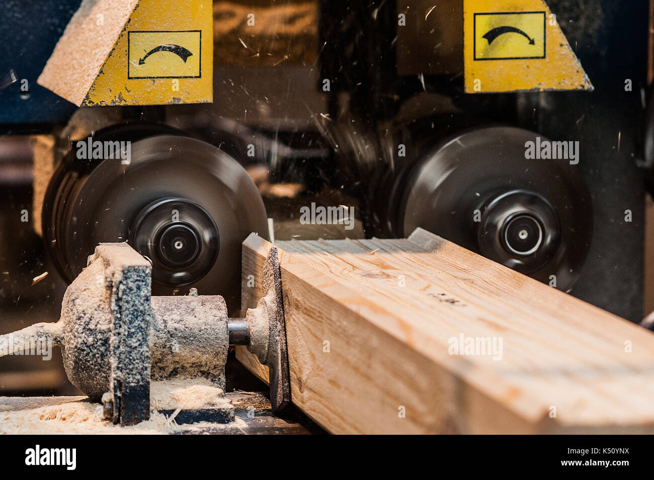Close up of a straight router bit cutting a groove or rabbet in a piece of oak. The machine for sampling the groove in a wooden beam. another view in  Stock Photo
