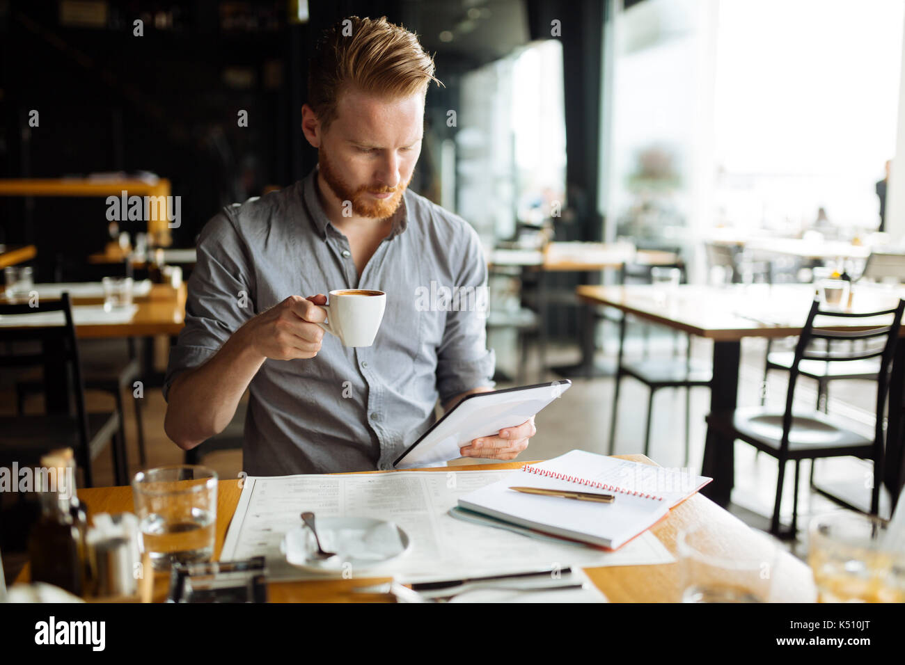 Bsuinessperson multitasking even during break Stock Photo