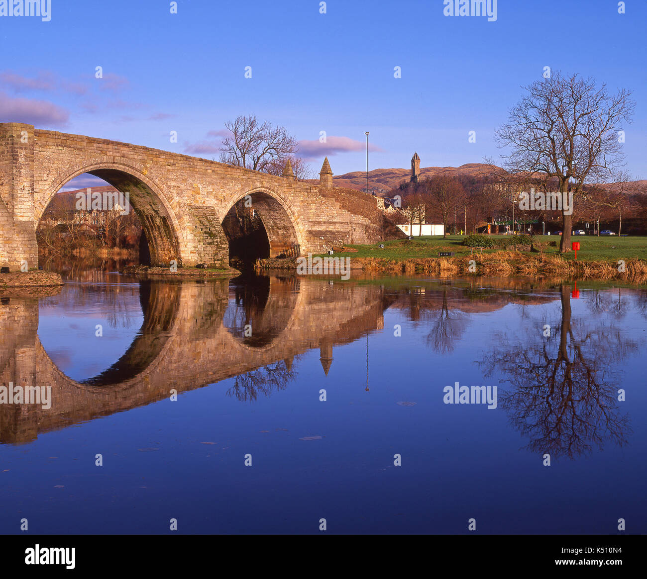 Winter reflections on the River Forth from The old Bridge, Stirling with the Wallace Monument in view, Central Scotland Stock Photo