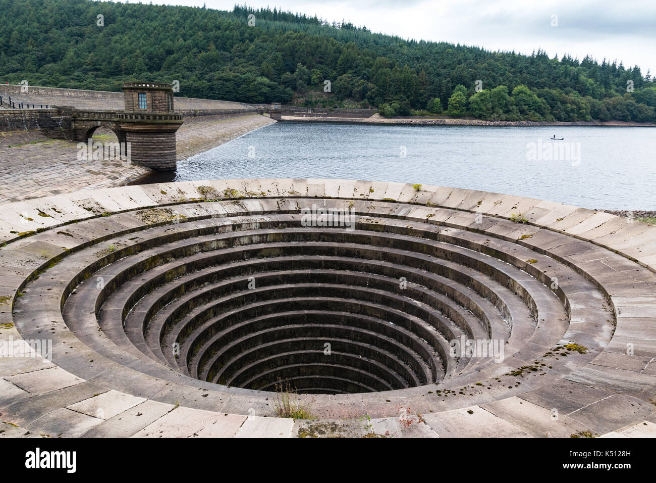 Concrete Overflow drain at Ladybower Reservoir. Reservoir water very