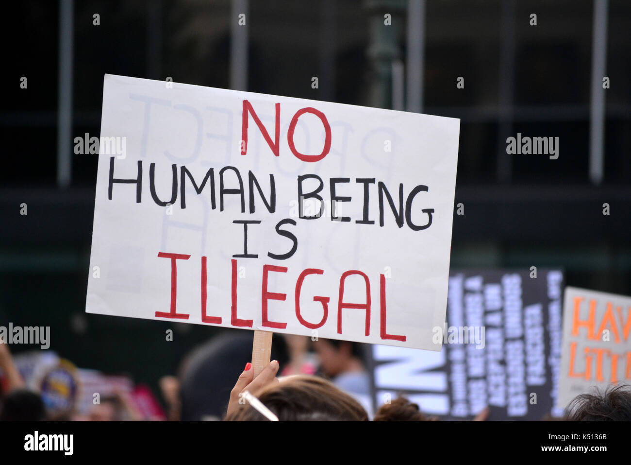 Sign protesting President Trump's decision to repeal the Deferred Action for Childhood Arrivals (DACA) policy in Lower Manhattan. Stock Photo