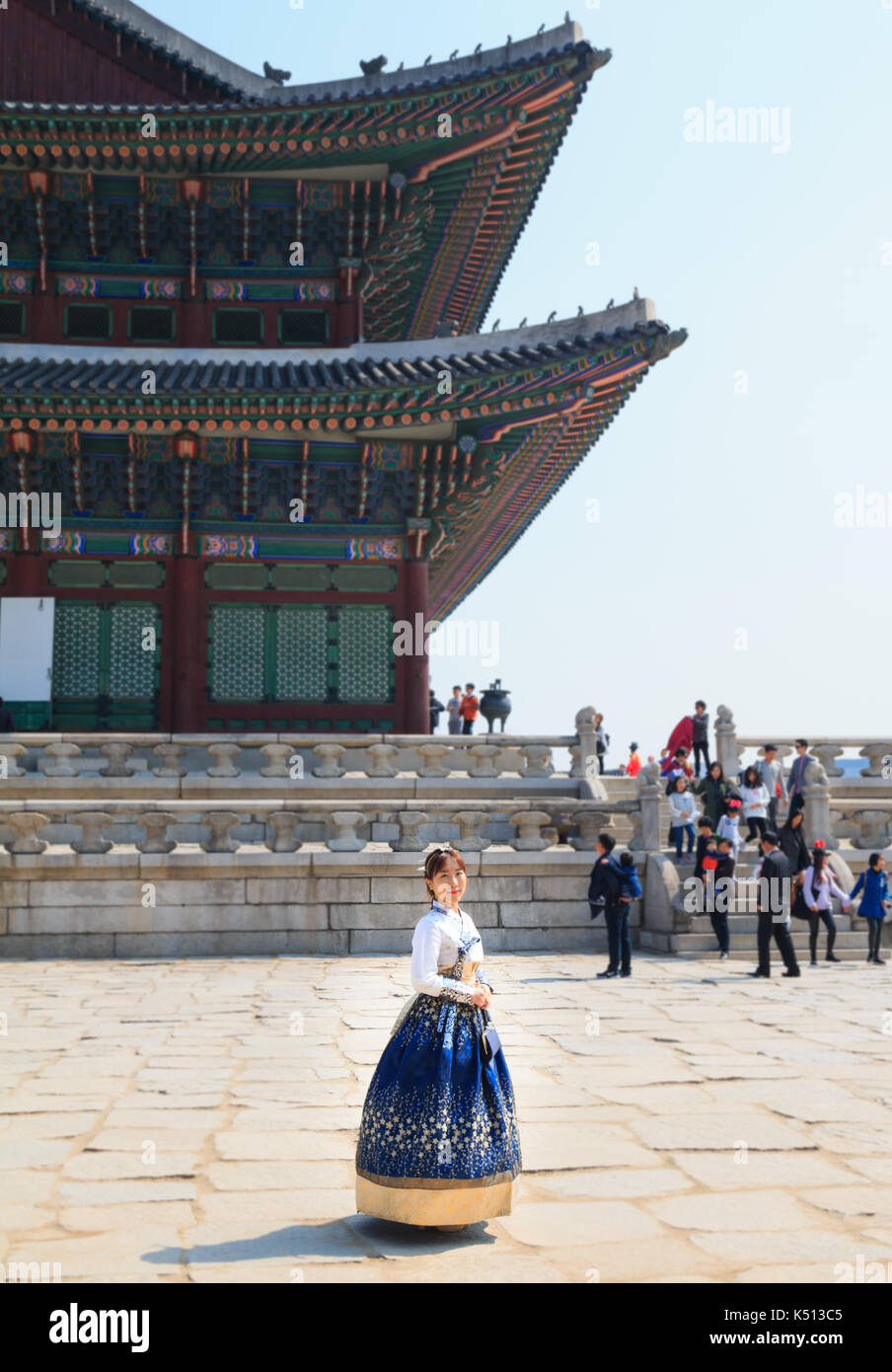 Beautiful Korean woman dressed Hanbok, Korean traditional dress, in Gyeongbokgung Palace, Seoul, South Korea Stock Photo