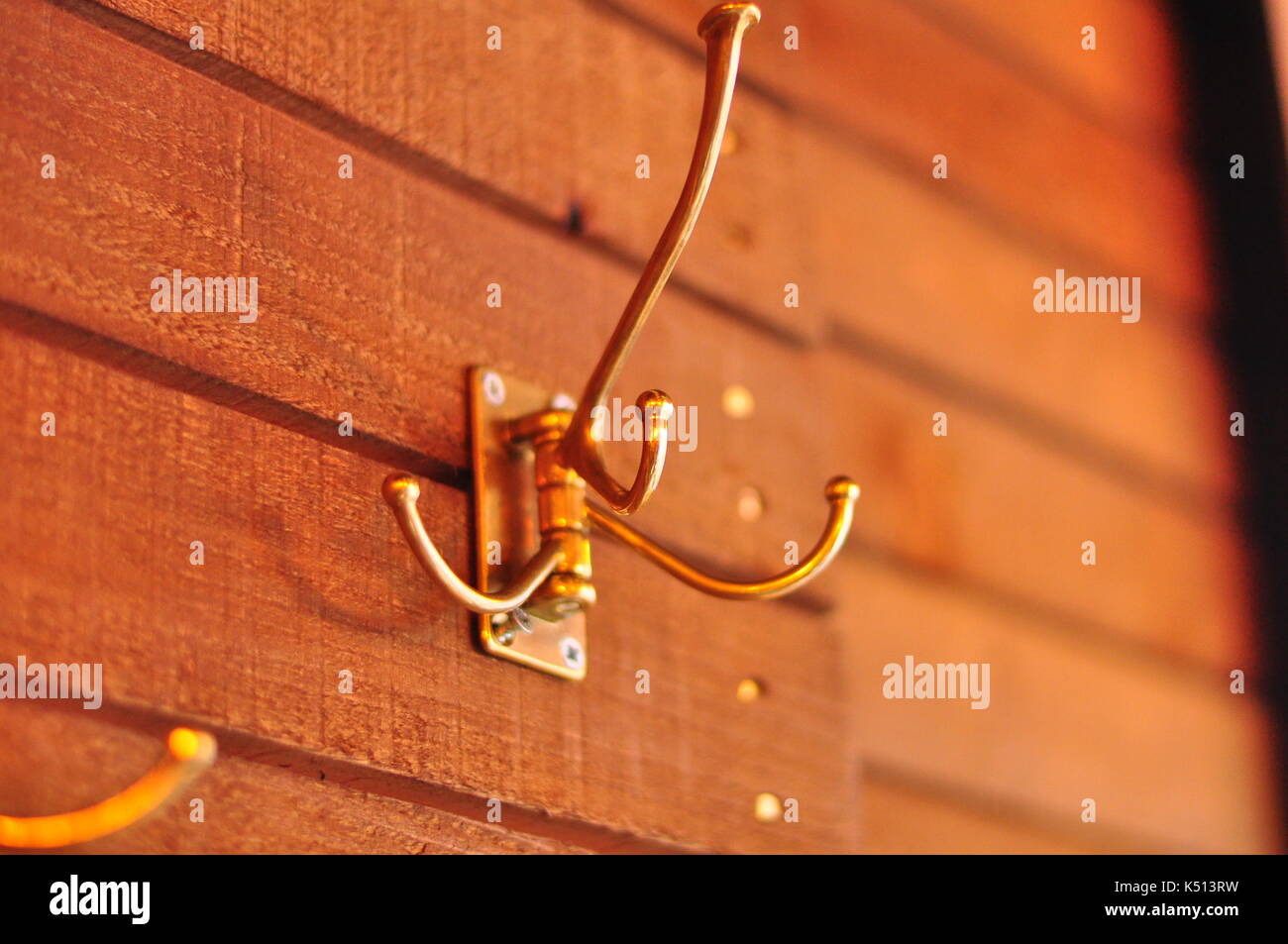 Hook on wooden wall to hang coats Stock Photo