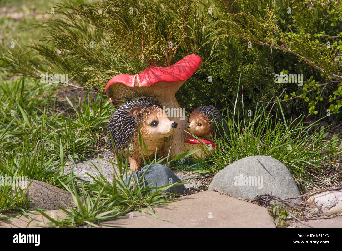 Toy Hedgehogs and mushroom in Park Stock Photo
