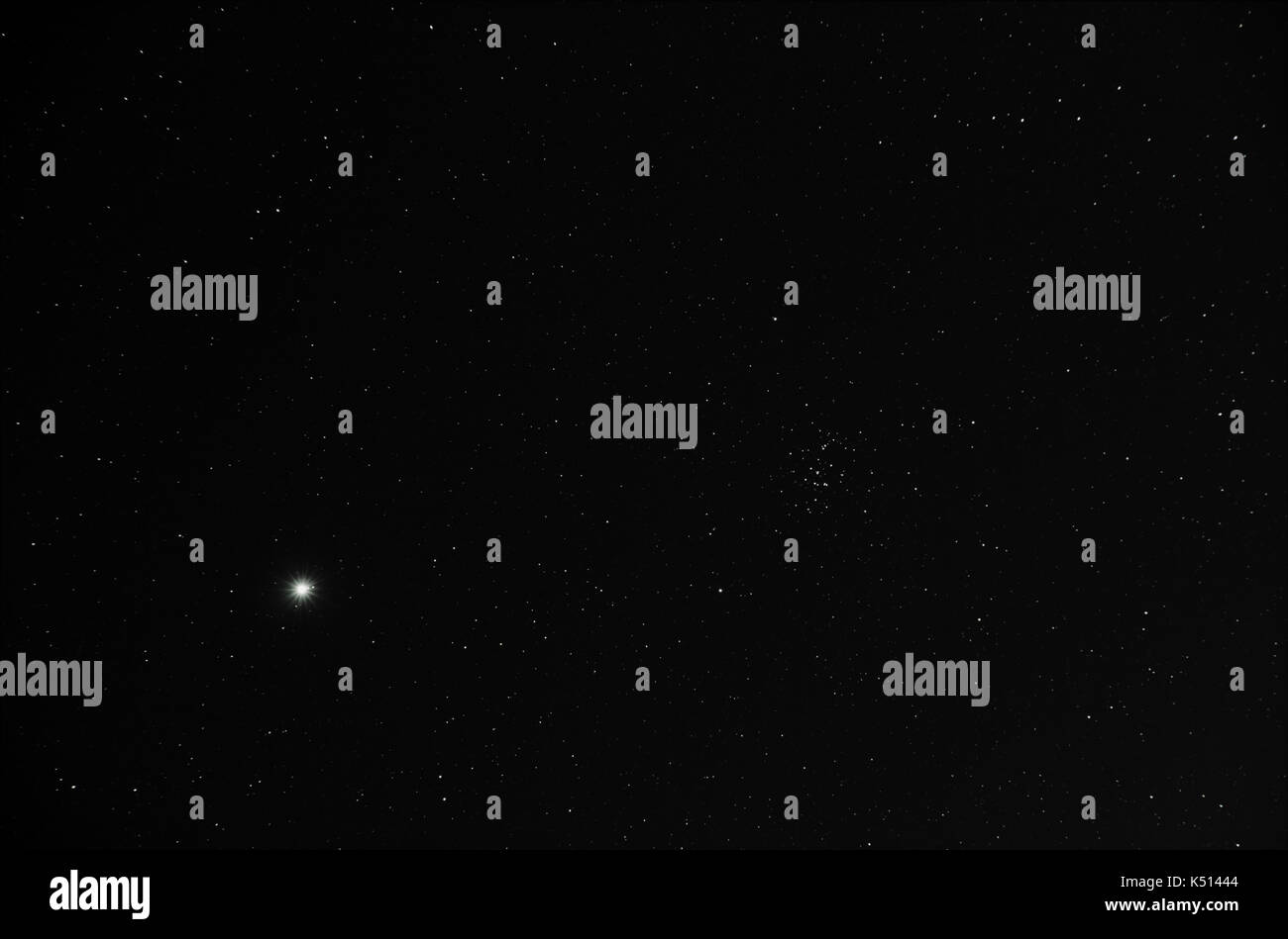 Jupiter and Praesepe at night sky Stock Photo